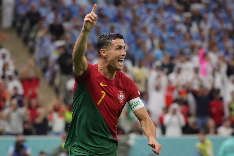 Cristiano Ronaldo of Portugal celebrates after scoring the opener. The goal was later awarded to Bruno Fernandes. EPA 