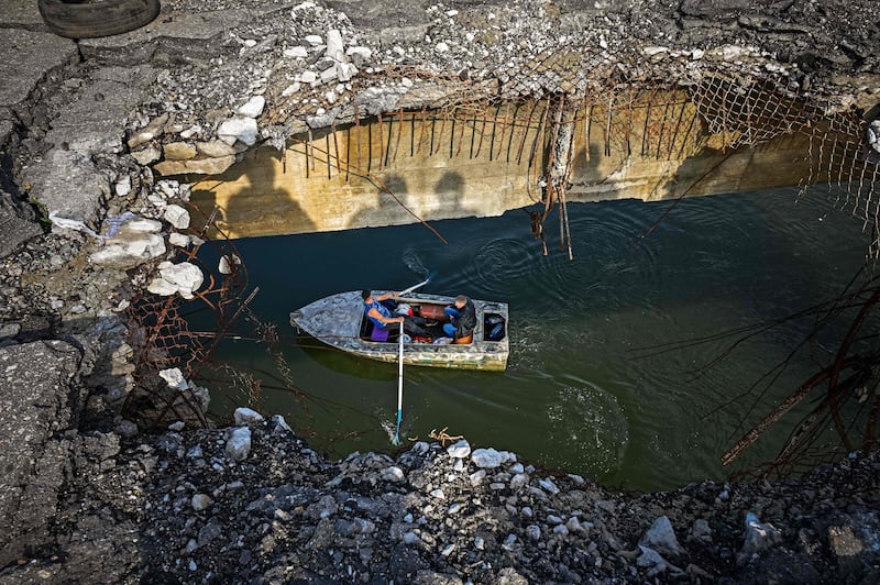 A destroyed bridge makes crossing the Donets river difficult, in Staryi Saltiv, east of Kharkiv, in September 2022. AFP