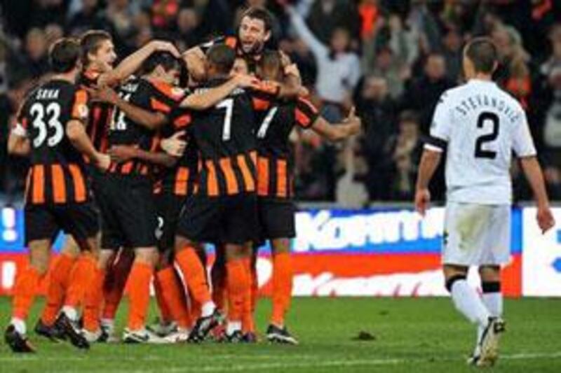 Players of FC Shakhtar celebrate after their victory over FK Partizan during their Group J, UEFA Europa League football match in Donetsk on October 1, 2009.