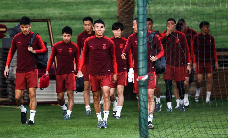 Players of China's national football team attend a training session as they prepare for the 2019 edition of the AFC Asian cup, in Qatar's capital of Doha on December 21, 2018.  / AFP / KARIM JAAFAR
