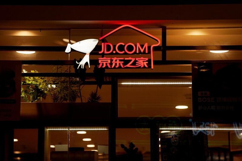 FILE PHOTO: A sign of China's e-commerce company JD.com is seen at its shop at a mall in Shanghai, China October 26, 2018. REUTERS/Aly Song/File Photo