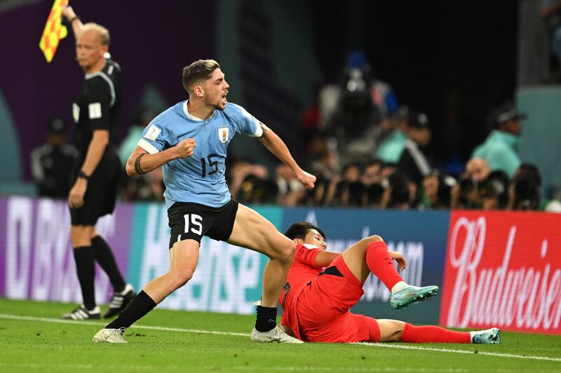 Federico Valverde of Uruguay reacts after a tackle on Lee Kang-in during their World Cup 2022 match at the Education City Stadium on Thursday, November 24. Getty