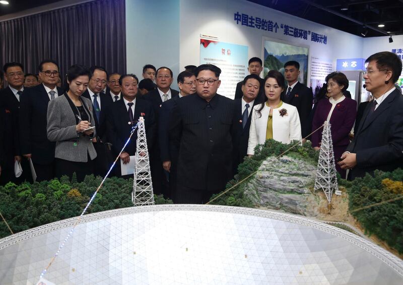 North Korean leader Kim Jong Un, centre, and his wife Ri Sol Ju, visit an exhibition highlighting achievements by the Chinese Academy of Sciences. Yao Dawei / Xinhua via AP