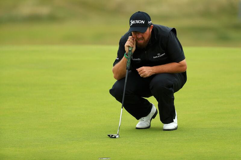 Lowry lines up a putt on the 16th green. Getty Images