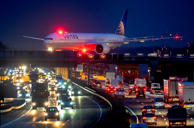 A United Airlines aircraft rolls over the motorway to its parking position after landing at Frankfurt Airport, Germany. AP