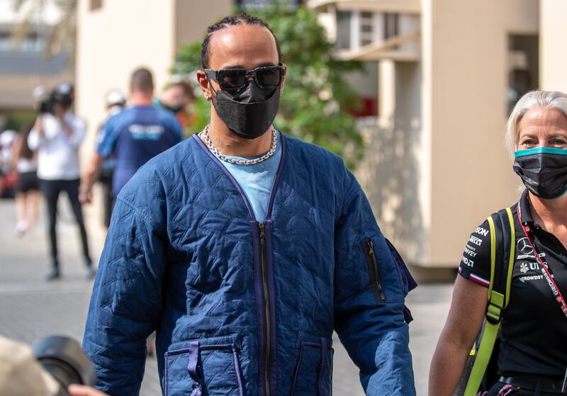 Mercedes driver Lewis Hamilton of Britain arrives at the Yas Marina Circuit. Hamilton and Max Verstappen will battle it out for the Formula One championship on Sunday. Victor Besa / The National