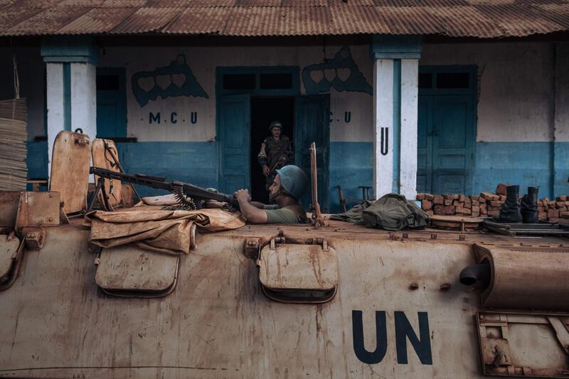 Peacekeepers stand guard outside the office of the Mouvement Coeurs Unis, the party of the newly re-elected President Faustin-Archange Touadera, in Bangassou. AFP