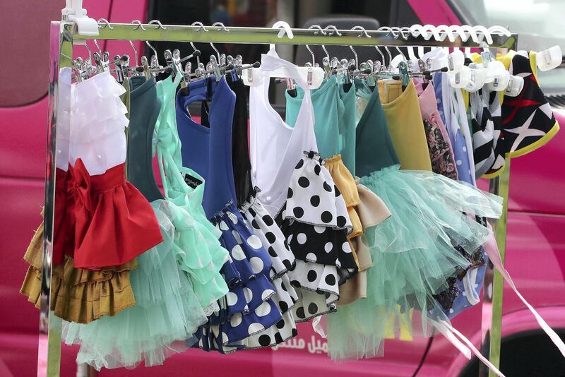 ABU DHABI , UNITED ARAB EMIRATES , APRIL 13   – 2018 :- Clothes for pets on display at the Shampooch stand during the pet festival held at DU arena on Yas Island in Abu Dhabi. ( Pawan Singh / The National ) For News