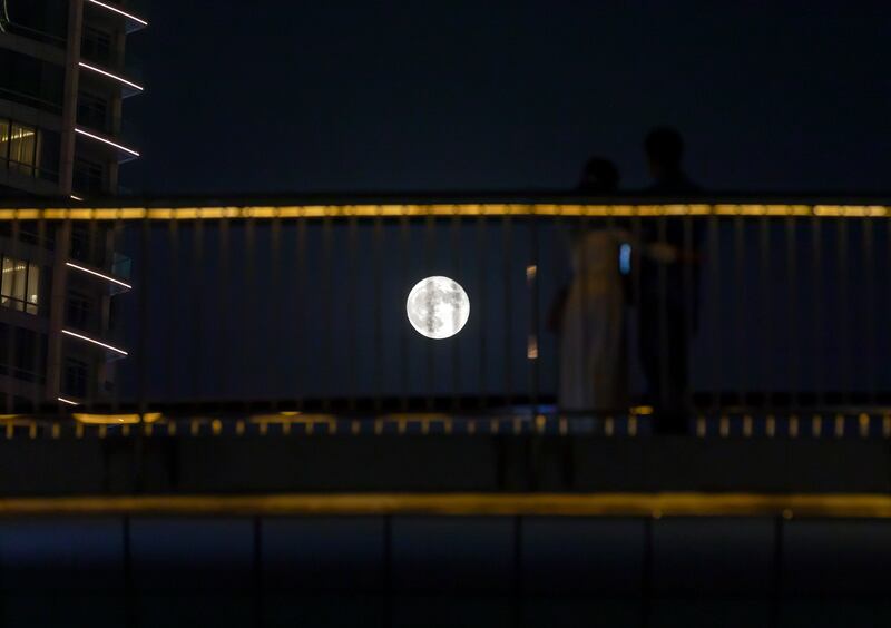 The blue moon rises over Downtown Dubai. Chris Whiteoak / The National