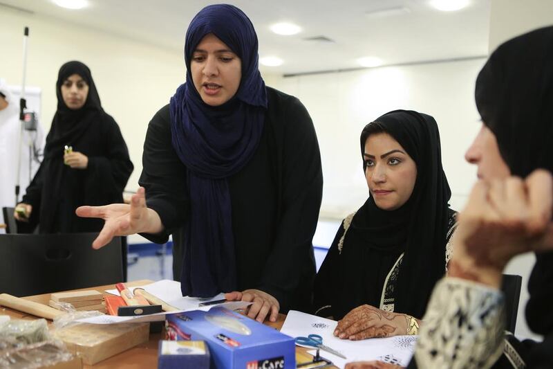  Azza Al Qubaisi, blue scarf, teaches an Islamic jewellery class at the Sharjah Museum of Islamic Civilisation. She says that people with a vision need help to realise their ideas. Sarah Dea / The National 