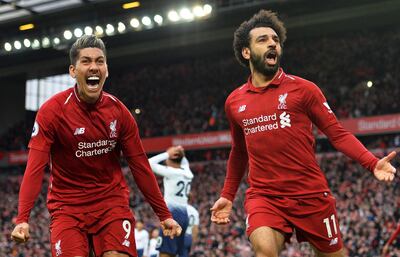 epaselect epa07476931 Liverpool players Roberto Firmino (L) and Mohamed Salah (R) celebrate their 2-1 lead during the English Premier League soccer match between Liverpool FC and Tottenham Hotspur at Anfield in Liverpool, Britain, 31 March 2019.  EPA/PETER POWELL EDITORIAL USE ONLY. No use with unauthorized audio, video, data, fixture lists, club/league logos or 'live' services. Online in-match use limited to 120 images, no video emulation. No use in betting, games or single club/league/player publications