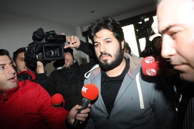 (FILES) This file photo taken on December 17, 2013 shows detained Azerbaijani businessman Reza Zarrab (C) surrounded by journalists as he arrives at a police center in Istanbul. 
Turkish-Iranian gold mogul Reza Zarrab will not stand trial in New York for allegedly defying sanctions on Iran, a US judge confirmed on November 27, 2017 at the start of jury selection.In a case that has inflamed tensions between Turkey and the United States, all signs now suggest that the 34-year-old businessman has cut a deal with prosecutors and agreed to plead guilty, which could potentially still see him testify.
 / AFP PHOTO / OZAN KOSE