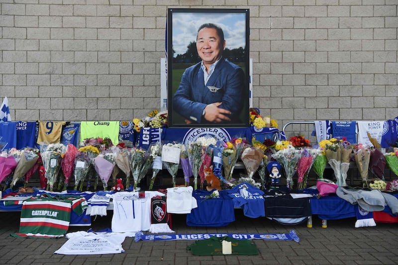 A portrait of Vichai Srivaddhanaprabha is seen amid flowers and tributes outside the King Power Stadium. AFP