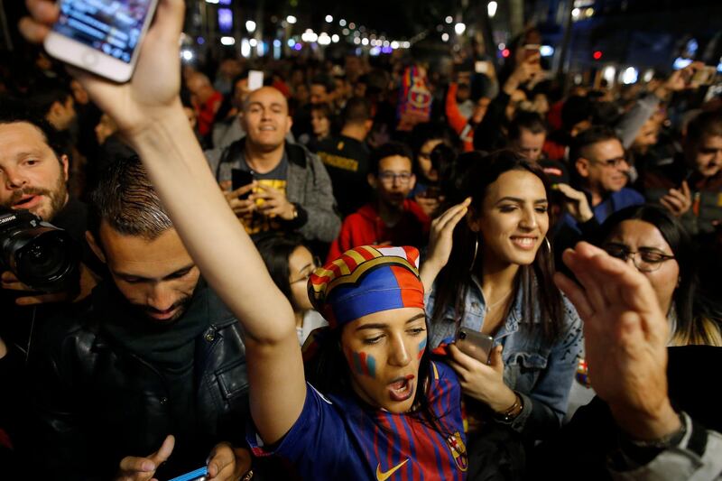 Barcelona supporters celebrate their team's victory in La Liga at Canaletas square on Las Ramblas in Barcelona. AP Photo/Manu Fernandez