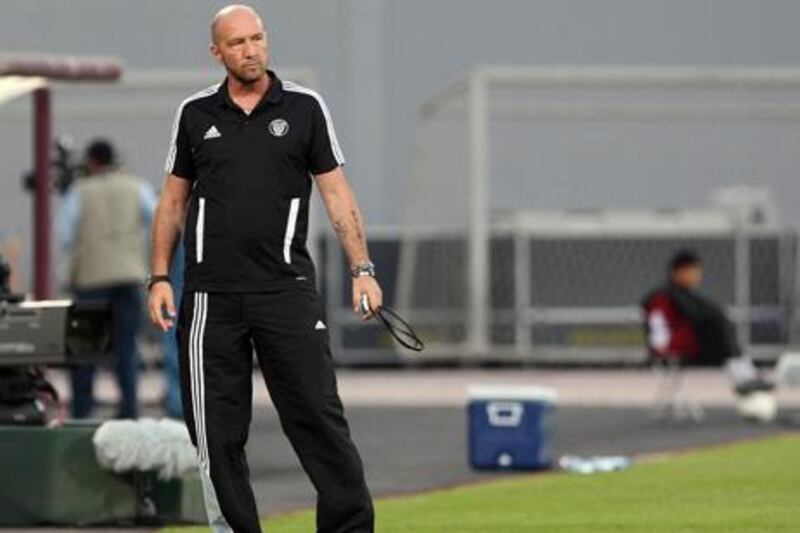 Abu Dhabi, United Arab Emirates, Presidents Cup, Al Nahyan Stadium- (left)  Al Nasr's Head Coach Walter Zenga
argues a call made by a line official at Al Nahyan Stadium in Abu Dhabi. Mike Young / The national
