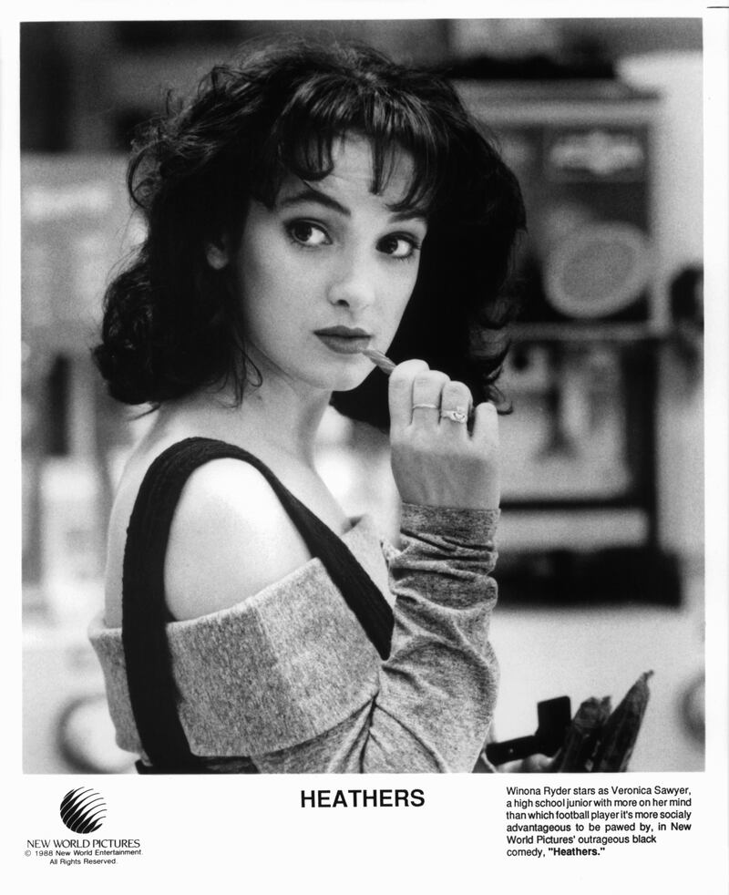 Winona Ryder is about to chew on a candy in a scene from the film 'Heathers', 1988. (Photo by New World Pictures/Getty Images)