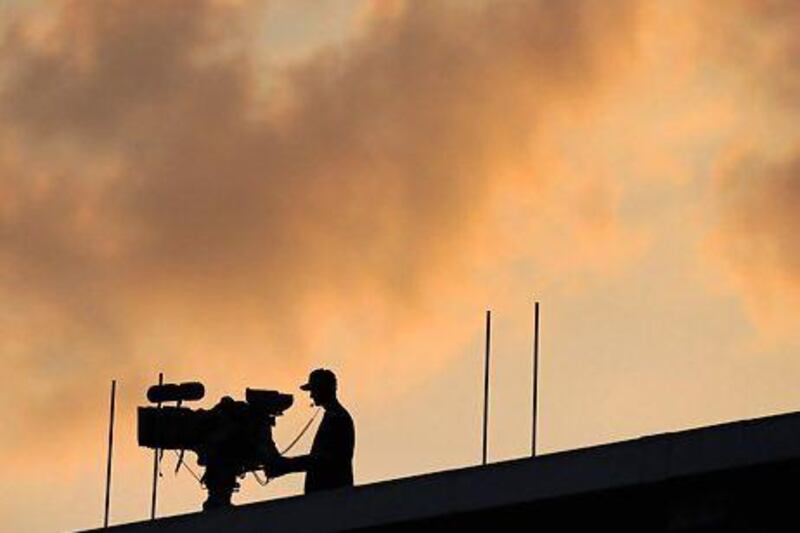 A television cameraman is silhouetted against the sky. Premium channels in the Mena region hold broadcast rights for major football matches. Press Association Images