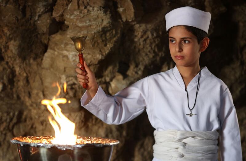 An Iraqi Kurdish Zoroastrian takes part in a ritual ceremony in an ancient and ruined temple of the Zoroastrian religion in the Iraqi Kurdish town of Darbandikhan. AFP