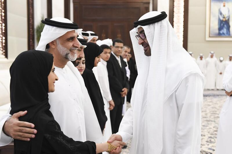Sheikh Mohammed bin Zayed greets a high achieving student and her father during an iftar reception at Al Bateen Palace. Rashed Al Mansoori / Crown Prince Court - Abu Dhabi
