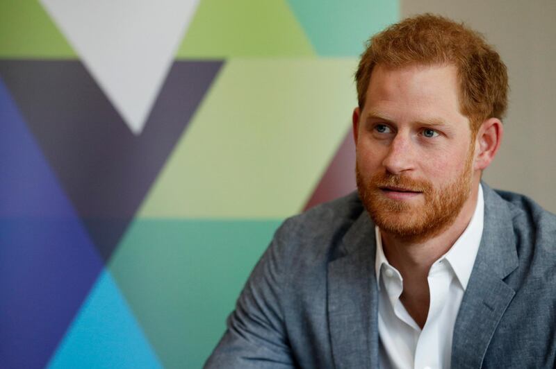 Britain's Prince Harry, Duke of Sussex listens to the Youth Ambassadors Mental Health Champions during a visit to YMCA South Ealing in west London, Wednesday,  April 3, 2019, to learn more about their work on mental health and see how they are providing support to young people in the area. (Adrian Dennis/Pool Photo via AP)