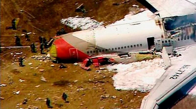 An Asiana Airlines Boeing 777 is pictured after it crashed while landing in this KTVU image at San Francisco International Airport in California, July 6, 2013. An Asiana Airlines Boeing 777 flying from Seoul crashed while landing on Saturday at San Francisco International Airport, the U.S. Federal Aviation Administration said. FAA spokesman Lynn Lunsford said it was flight No. 214, and she said it was unclear how many people were on board. 
REUTERS/KTVU/Handout via Reuters  (UNITED STATES - Tags: DISASTER TRANSPORT) ATTENTION EDITORS - NO SALES. NO ARCHIVES. FOR EDITORIAL USE ONLY. NOT FOR SALE FOR MARKETING OR ADVERTISING CAMPAIGNS. THIS IMAGE HAS BEEN SUPPLIED BY A THIRD PARTY. IT IS DISTRIBUTED, EXACTLY AS RECEIVED BY REUTERS, AS A SERVICE TO CLIENTS. MANDATORY CREDIT *** Local Caption ***  TOR310_USA-CRASH-AS_0706_11.JPG