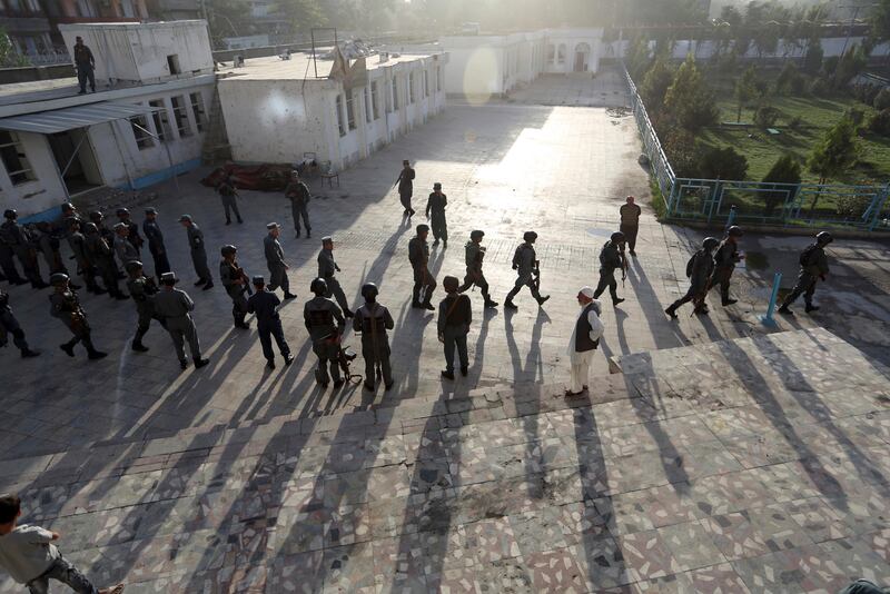 Afghan security police arrive at a Shiite mosque where gunmen attacked during Friday prayers, in Kabul, Afghanistan. Rahmat Gul / AP Photo