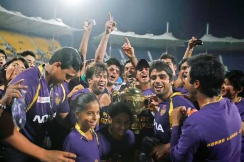Shahrukh Khan, wearing glasses, owner of the Kolkata Knight Riders, celebrates alongside his players after they won the Indian Premier League title last year. Apart from the format, the IPL owes its success to the involvement of the country's big corporations and Bollywood stars such as Shahrukh. Aijaz Rahi / AP Photo