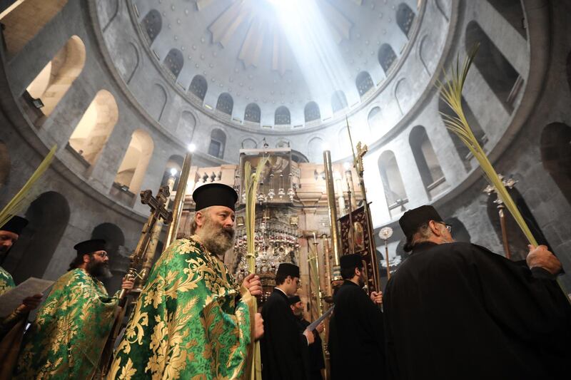 Greek Orthodox clergymen attend the procession in Jerusalem. Palm Sunday in when many churches symbolically mark the biblical account of the entry of Jesus into Jerusalem. EPA