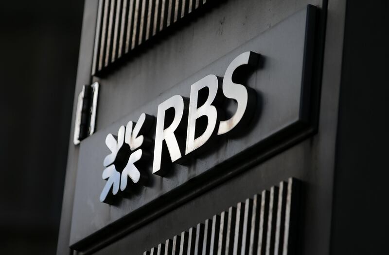 An RBS logo is pictured outside a Royal Bank of Scotland (RBS) bank branch in central London on August 4, 2017.
Britain's state-rescued Royal Bank of Scotland has picked Amsterdam as a post-Brexit EU base, it said Friday as it rebounded into second-quarter profit. The troubled bank revealed it was preparing its Brexit contingency plan by engaging with the Dutch central bank to use its existing banking licence in the Netherlands, in a move which will see RBS employ 150 staff in Amsterdam. / AFP PHOTO / Daniel LEAL-OLIVAS
