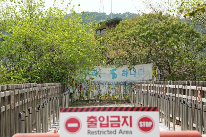A banner and ribbons supporting the reunification of North and South Korea at Imjingak Pavilion, Paju, near the border between them. AP