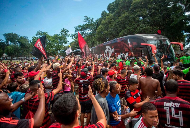 Flamengo supporters cheered as the team bus arrived at the Rio airport on Friday. AFP