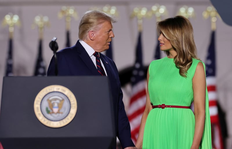 U.S. President Donald Trump talks to U.S. first lady Melania Trump before delivering his acceptance speech as the 2020 Republican presidential nominee during the final event of the Republican National Convention on the South Lawn of the White House in Washington, U.S., August 27, 2020. Reuters