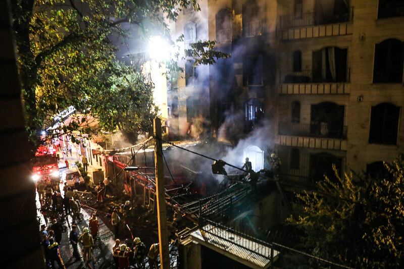 Paramedics gather at the scene of the explosion. AFP Photo