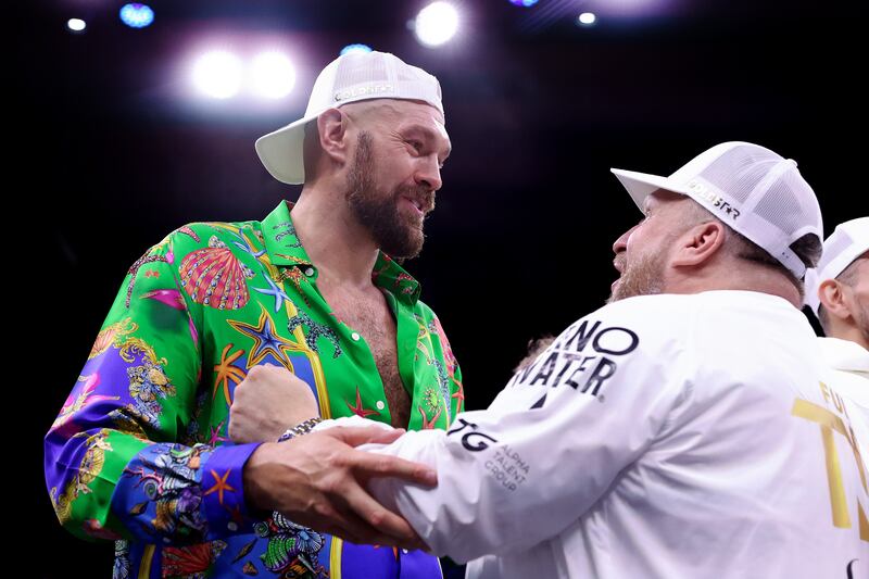 WBC heavyweight champion Tyson Fury celebrates with the Fury Coaching Team after seeing half-brother Tommy Fury defeat Jake Paul at the Diriyah Arena. Getty Images