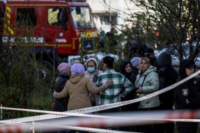Residents gather near the scene of a Russian missile strike in Uman. Reuters