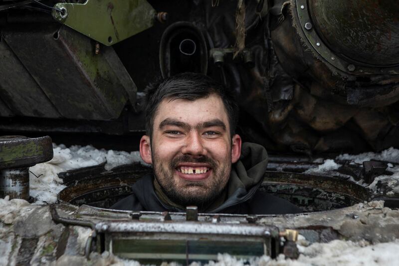 A Ukrainian serviceman inside a tank outside the frontline town of Bakhmut. Reuters