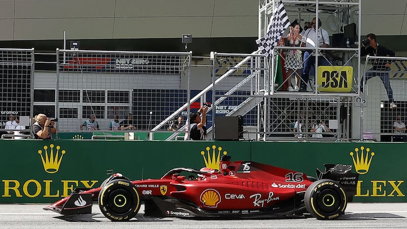Ferrari's Charles Leclerc crosses the finish line to win the race. AFP