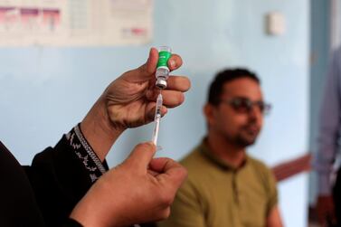 A man waits to receive the AstraZeneca vaccine against Covid-19 at a medical centre in Taez, Yemen. Reuters 