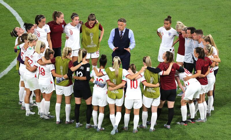England manager Phil Neville talks to his players after their World Cup semi-final defeat to the USA in 2019. PA