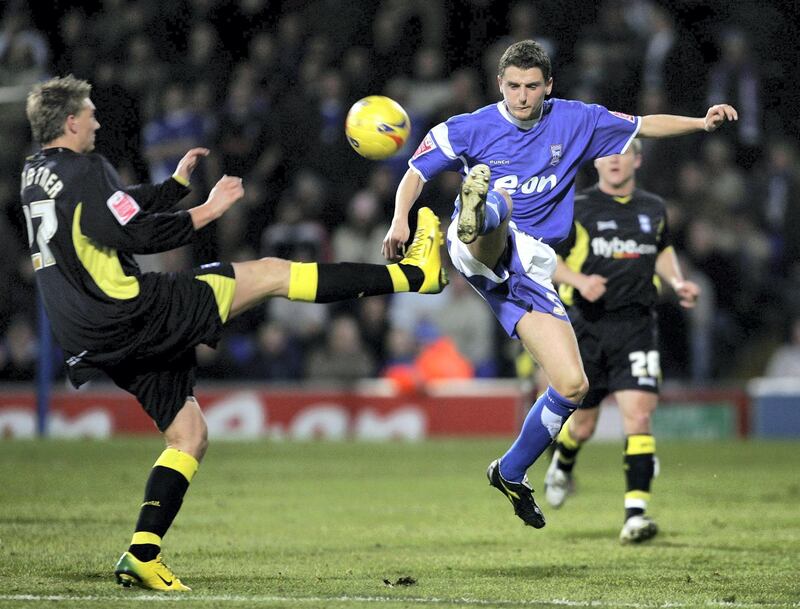 IPSWICH, UNITED KINGDOM - JANUARY 01:  Alex Bruce of Ipswich wins the ball in the air from Nicklas Bendtner of Birmingham during the Coca-Cola Championship match between Ipswich Town and Birmingham City at Portman Road on January 1, 2007 in Ipswich, England.  (Photo by Christopher Lee/Getty Images)