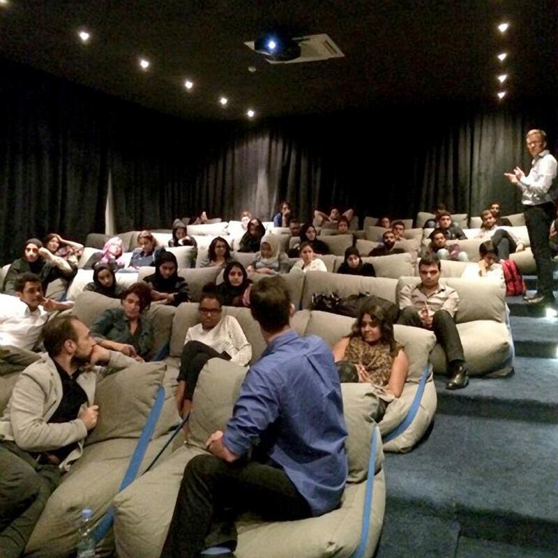 The communal space at A$ in Dubai features a small screening room with beanbag chairs. Courtesy A4