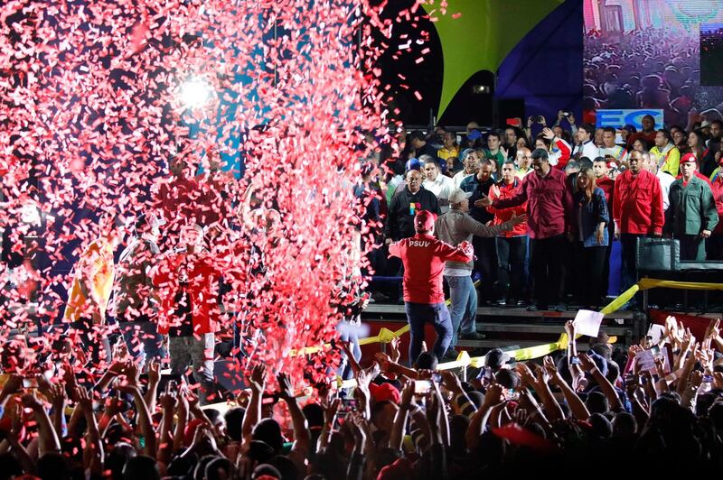 Confetti falls as supporters walk up to greet Venezuela's President Nicolas Maduro during a gathering after the results of the election were released, outside of the Miraflores Palace in Caracas, Venezuela. Carlos Garcia Rawlins / Reuters