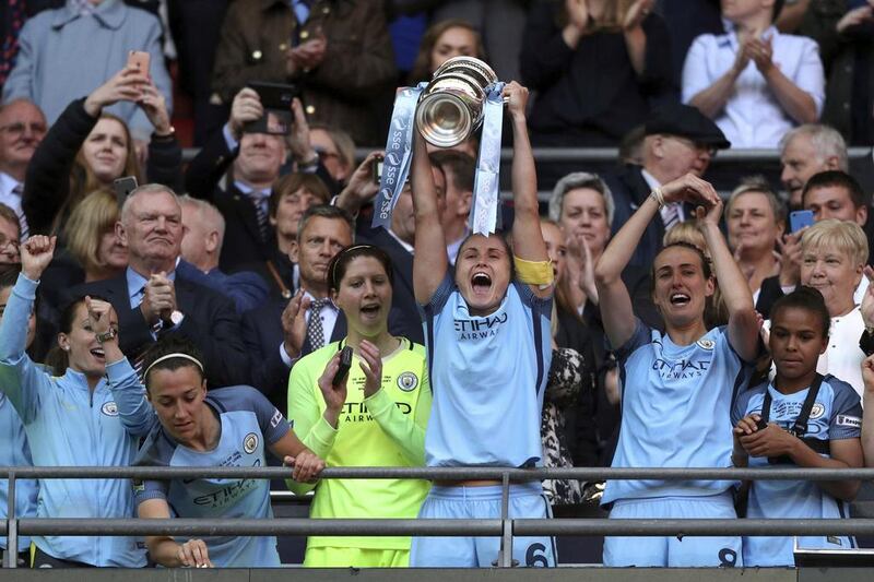 Manchester City’s Steph Houghton lifts the trophy after winning the Women’s FA Cup final. Adam Davy / PA