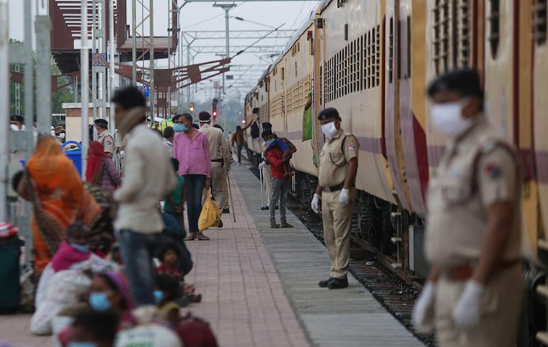 Migrant workers disembark from a special train that arrived from Nasik during a government-imposed nationwide lockdown as a preventive measure against the COVID-19 coronavirus, at Misrod railway station in Bhopal. AFP