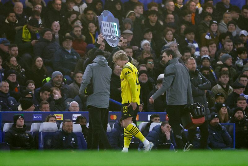 Borussia Dortmund's Julian Brandt leaves the pitch after picking up an injury early in the game. Reuters 