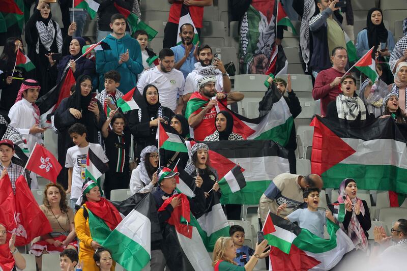 Palestine flags were waved ahead of the Asian Cup game at the Abdullah bin Khalifa Stadium in Doha. AFP 