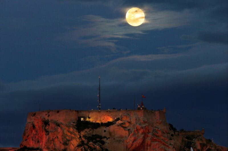 The full moon rises over the Santa Barbara Castle in Alicante, eastern Spain. EPA