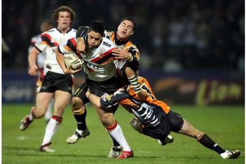 Bradford Bulls' Shontayne Hape is tackled during the Rugby League World Club Challenge against Wests Tigers.