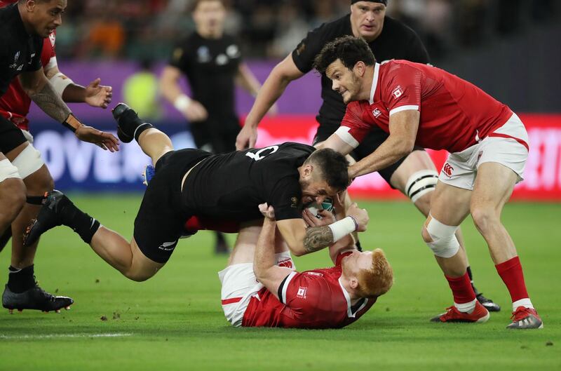 New Zealand's TJ Perenara in action with Canada's Peter Nelson New Zealand v Canada - Oita Stadium, Oita, Japan. REUTERS