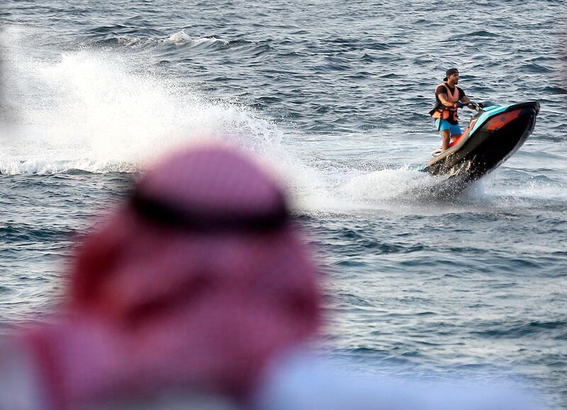 A Saudi holiday maker rides a jet ski at Red Sea resort of Obhur, in Jiddah, Saudi Arabia. AP Photo